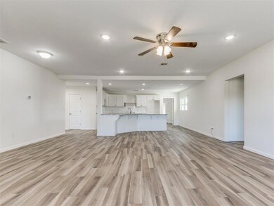 Unfurnished living room with light wood-style floo