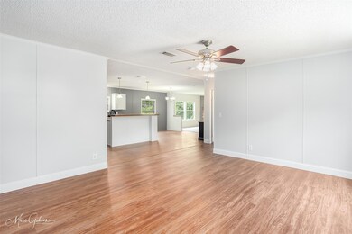 Spare room featuring light hardwood / wood-style f