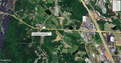 Aerial map of property and surrounding area with property parcel outlined