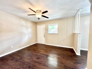 Foyer featuring a textured ceiling, ceiling fan, a