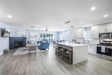 Kitchen with light wood-type flooring, a kitchen i