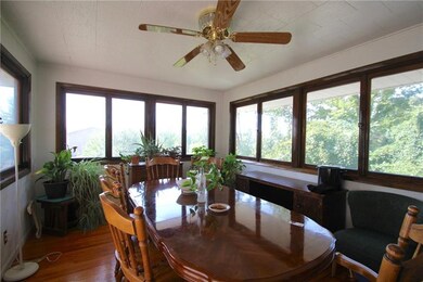 Dining room is filled with natural light and views