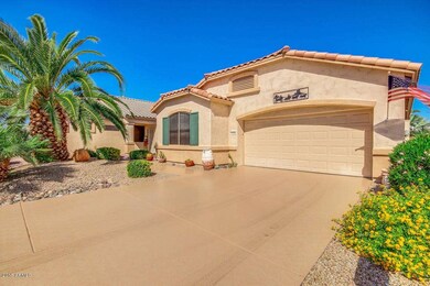 Front of Home with coated driveway