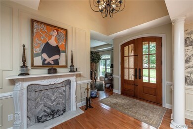 Hardwood floored entrance foyer featuring french d
