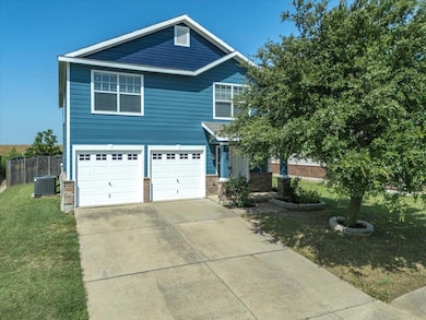 View of exterior entry with a garage and covered porch