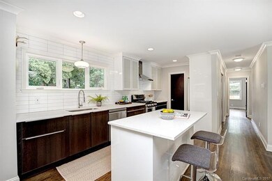 Tile backsplash and island with breakfast bar!