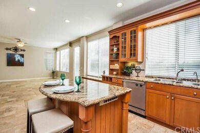 View from kitchen to family room. Chiseled stone f