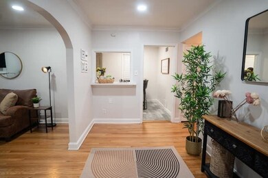 Interior space featuring ornamental molding and li