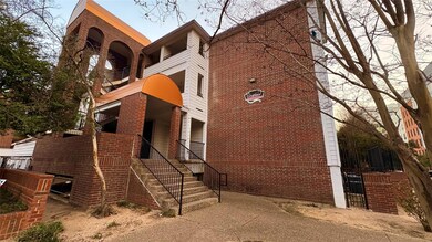 View of building exterior featuring stairway