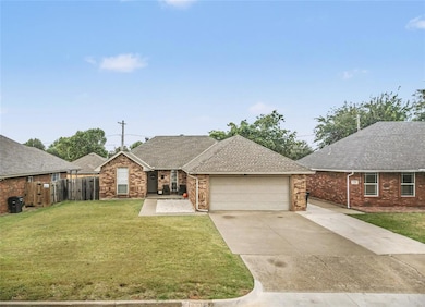 Ranch-style house featuring roof with shingles, concrete driveway, brick siding, and an attached garage