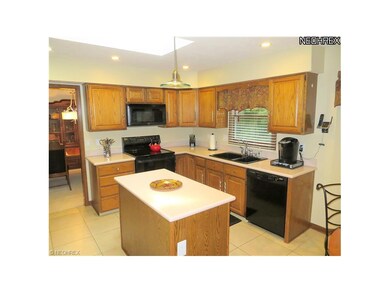 Oak Kitchen w/Travatine Tile Floor. Island. Corien
