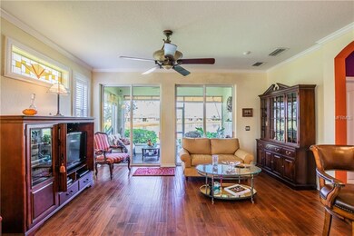 Living room with glass sliding doors to the lanai.