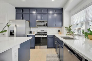 Kitchen with stainless steel appliances, tasteful