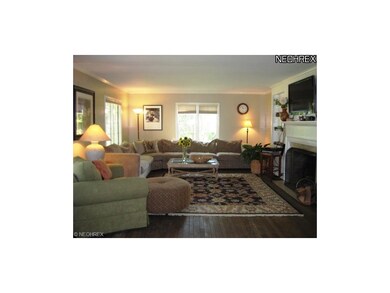Light filled living room with classic fireplace an