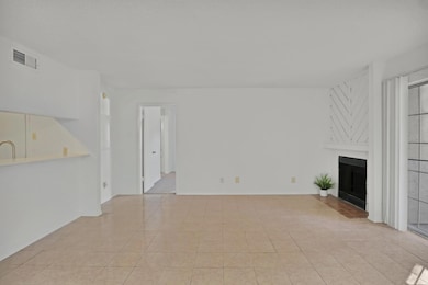 Unfurnished living room with light tile patterned 