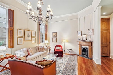 Living space with 12 feet ceiling, wooden shutters