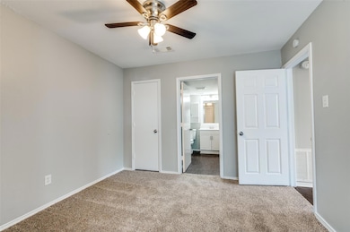 Unfurnished bedroom featuring connected bathroom, 