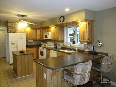 Kitchen hickory cupboards, corian countertops and 