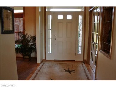 Open foyer with hardwood floors