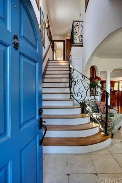 Gorgeous entry showcases hand-crafted wrought iron