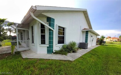 View of side of home featuring stucco siding and a
