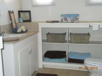 Bathroom has tub and separate shower