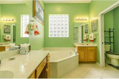 Owner's Bath with Dual Sinks and separate tub and 