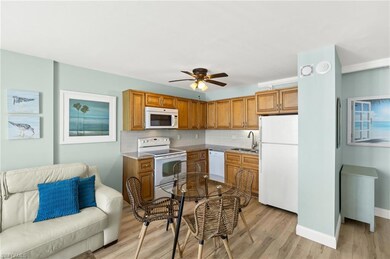 Kitchen featuring light wood finished floors, a si