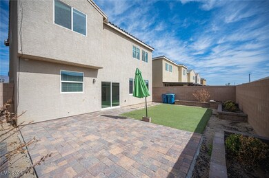 Rear view of property with a fenced backyard, a pa