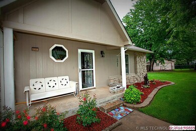 Inviting front porch and nice landscaping.