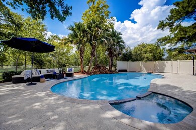Custom pool with umbrella holders.