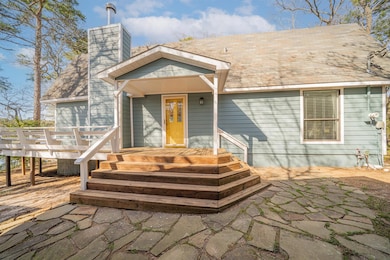 View of front of property with roof with shingles 
