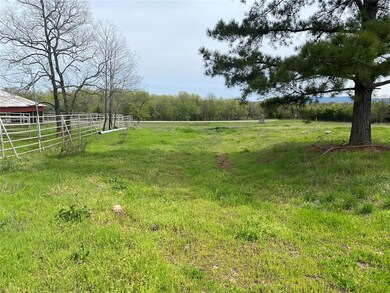 View of yard with a rural view
