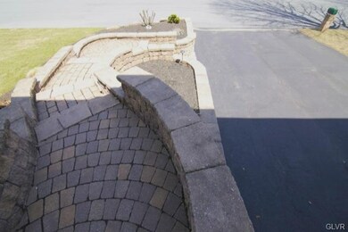 2392  Features paver walkways throughout the front
