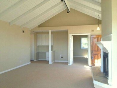 Living room view from the deck with front door and