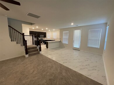 Kitchen opened to dining and living room