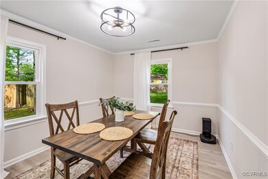 Dining room with a chandelier, plenty of natural l