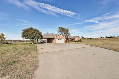 Single story home featuring concrete driveway, a c