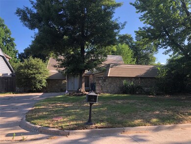 Split level home featuring a front yard