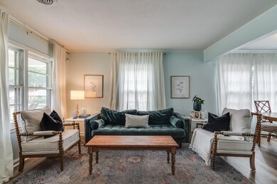 Living room featuring crown molding and hardwood /