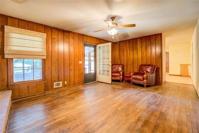 Living area featuring visible vents, wood finished