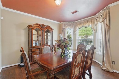 Dining area with wood finished floors, baseboards,