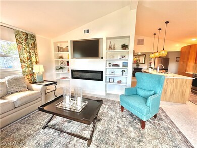 Living area with built in shelves, a glass covered