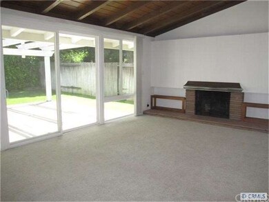 Living room with vaulted ceilings & wall of window