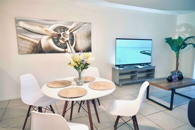Dining space with baseboards and tile patterned fl