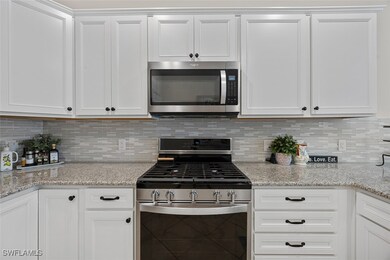 Kitchen with appliances with stainless steel finis