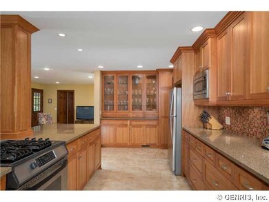 Kitchen. Custom built-in hutch with glass front ca