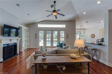 Large great room with fireplace, wood floors and g