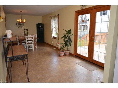 Entry from Deck leads to Dining Room and Kitchen