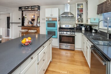 The cook in the family is going to truly appreciate the remodeled kitchen with its sparkling window, modern track lighting, white showcase cabinetry, handy pantry, quartz counter-tops, undermount basin, pull-down faucet, state-of-the-art stainless-st